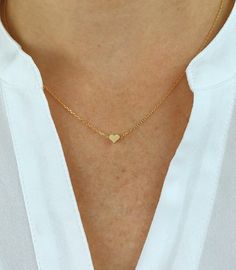 "Dainty necklace, gold Heart necklace, gold necklace, Dainty jewelry, gift for her, simple necklace, gift for women, dainty necklace, birthday gift for her Simple and dainty gold heart necklace. D E T A I L S: *5mm tiny gold plated heart *18\" gold plated chain *Lobster clasp closure This style is also available in rose gold and silver in our shop! SHIPPING: *Free domestic shipping on all orders PACKAGING: *All pieces come beautifully packaged, perfect for gift giving. Find more to ❤️ here: http Handmade Heart Necklace For Everyday Wear, Handmade Everyday Heart Necklace, Everyday Handmade Heart Necklace, Dainty Gold Plated Heart Pendant Jewelry, Delicate Heart Charm Jewelry For Mom, Delicate Heart Charm Jewelry As Gift For Mom, Minimalist Heart Charm Jewelry For Mom, Delicate Heart Charm Jewelry Gift For Mom, Delicate Jewelry With Heart Charm For Mom