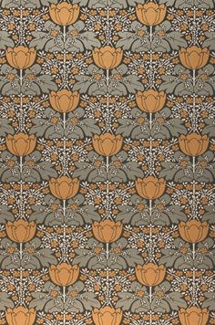 an orange and gray wallpaper with flowers on the side, in front of a black background