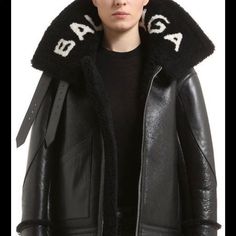 Balenciaga's Oversized Shearling 'Le Bombardier' Jacket Riffs On Classic Biker Styles And Will Keep You Warm On Even The Coldest Days. It Has All The Details Of The Time-Honored Style, Including Buckled Trims And Pockets, But Its Standout Feature Is The House's Logo, Printed Around The Fuzzy Collar. Balenciaga Leather Jacket, Shearling Leather Jacket, High Collar Jacket, Balenciaga Jacket, Women Logo, Balenciaga Leather, Balenciaga Women, Jackets Black, Balenciaga Black