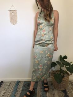 100% Silk Vintage Laura Ashley dress in sage green with floral pattern.  Beautiful and comfortable dress, perfect for a formal event.  Size 8 AUS Green Sheath Maxi Dress For Formal Occasions, Chic Fitted Silk Floral Dress, Spring Silk Dress With Floral Print For Garden Party, Spring Floral Print Silk Dress For Garden Party, Elegant Sheath Maxi Dress With Floral Print, Green Silk Midi Dress For Wedding, Spring Silk Sheath Midi Dress, Spring Satin Sheath Maxi Dress, Elegant Spring Silk Dress With Floral Print