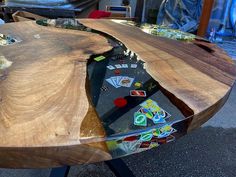 a wooden table that has been made to look like it is being used for playing cards