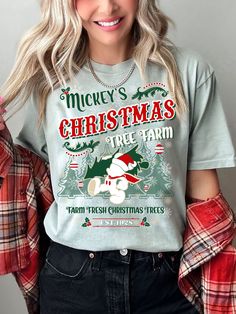 Mickey's Christmas Tree Farm Shirt brings you Christmas apparel w/ classic vintage holiday style! Christmas Shirts never looked as cute as when Santa Mickey is involved! SHIPS IN 3 to 4 BUSINESS DAYS FROM PURCHASE! All LBV Apparel are Original Designs created by Shop Owners: Maria & Chris (We Design & Create Everything Ourselves!) Screen Printed for the BEST in QUALITY Printing: Vibrant Colors/Graphics that Last Decades. (NEVER DTG or Iron On Vinyl!) Premier Luxury Tier Tee Brands & Fabrics Colo Cricut Disney Christmas Shirt Ideas, Disney Xmas, Santa Mickey, Disney Christmas Shirts, Disney World Christmas, Disney Bounds, Disney 2024, Christmas Apparel, Svg Ideas