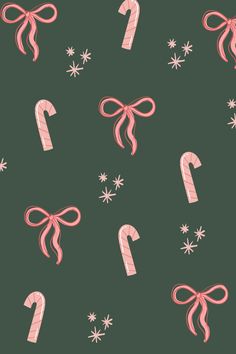 candy canes with bows and snowflakes on a green background