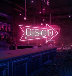 a neon sign that says disco in front of a bar with chairs and bottles on the counter