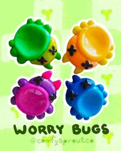 three different colored plastic toys with the words worry bugs