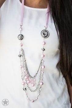 A silky pink ribbon replaces a traditional chain to give an elegant look. Pearly pastel pink beads and funky silver pieces intermix with varying lengths of silver chains to give a fresh take on a Victorian-inspired piece.

Sold as one individual necklace. Includes one pair of matching earrings. Pink Pearl Necklace, Grey Beads, Ribbon Necklace, Silver Chains, Pink Necklace, Jewelry Images, Paparazzi Accessories, Pink Beads, Chic Jewelry