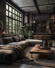 a living room filled with lots of furniture and large windows in the wall behind it