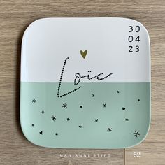 a plate with the word love written on it and stars in the bottom right corner