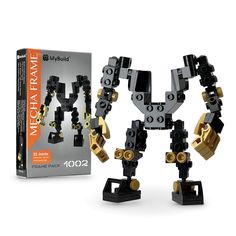 a black and gold robot made out of legos next to a box with instructions on how to build it