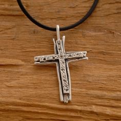 Share the spirit of faith with someone you hold dear. This sterling silver double cross necklace is a fitting gift for anyone on your gift list. It features two sterling silver crosses that have been hand-designed and melded together in a harmony of design. Suspended from a sterling silver chain or a leather cord with silver clasp and endings. It makes a gorgeous accessory that can be worn every day or reserved for those special occasions. It provides you with the unique opportunity to accessori Personalized Sterling Silver Cross Pendant Necklace, Personalized Sterling Silver Pendant Cross Necklace, Adjustable Sterling Silver Crucifix Necklace, Spiritual Sterling Silver Cross Necklace, Sterling Silver Cross Pendant Jewelry, Spiritual Crucifix Cross Necklace For Anniversary, Personalized Silver Cross Necklace, Sterling Silver Cross Pendant Necklace For Anniversary, Handmade Sterling Silver Cross Pendant Necklace