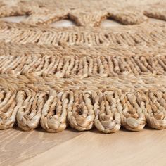 an area rug made out of jute and rope