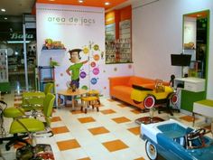 an orange and white checkered floor in a store with children's toys on display