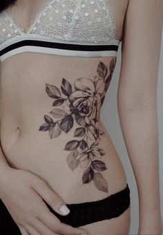 a woman's stomach with flowers on it