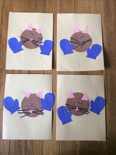 four pieces of paper that have been cut out to look like cats with blue hearts