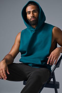 Stay cozy without sacrificing style in the Renown Sleeveless Hoodie. It has deep armholes, a kangaroo pocket, and a laid-back cut. And wait till you feel the Alo signature Renown fabric—it's smooth on the outside, a little fleecy on the side, and heavyweight for a just-right drape. Add shorts and you’re covered from the gym to the street. Alo Yoga Hooded Top With Drawstring Hood, Sleeveless Alo Yoga Athleisure Top, Sleeveless Alo Yoga Activewear For Gym, Alo Yoga Sleeveless Athleisure Top, Fall Gym Tops With Pockets, Alo Yoga Sporty Sleeveless Top, Alo Yoga Sleeveless Activewear For Gym, Hooded Alo Yoga Athleisure Top, Athleisure Tops With Pockets For Streetwear