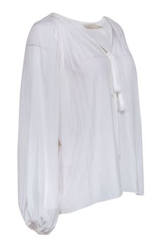 Let Ramy Brook wow you with this all-white peasant top, featuring delicate ties at the neckline and a flattering v-neck cut. With pleating throughout the design, this top is perfect for any occasion - dress it up with a skirt and heels for an elegant evening look, or pair it with jeans and sandals for a casual daytime outfit. Size XS Shell 100% Polyester Unlined Flowy silhouette V neck w/ ties Elasticized cuffs Bust 48” Waist 54” Sleeve length 28” Shoulder to hem 26” White Peasant Top, French Girl Chic, Chic Shop, Ramy Brook, Buy Shoes Online, Peasant Top, French Girl, Peasant Tops, Women's Wardrobe