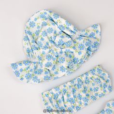 LIGHT BLUE FLORAL BLOOMER, TOP AND HAT SET - This listing is for a set of Bloomer, Top and Hat - Made of NON-STRETCHY 100% cotton fabrics that are comfortable to wear in trendy prints. Made with lots of attention to detail. - The Hat is very stretchy, it will be able to fit your baby head for a long time. - This set is perfect for Baby Sun Bath, Beach Day, Park Day, Photo shoot or Summer time! - Machine wash cold/gentle cycle, lay flat to dry & touch up with an iron. SHIPPING INFO: - FREE sh Cute Beach Bonnet One Size, Cute Beach Bonnet With Curved Brim, Cute Beach Bonnet, Playful Blue Hats With Upf 50+, Playful Blue Sun Hat For Summer, Cute Blue Sun Hat For The Beach, Playful Blue Sun Hat For Playtime, Light Blue Beach Hat One Size Fits Most, Cute Blue Sun Hat For Beach