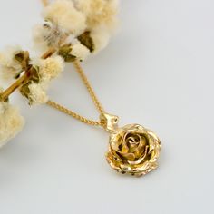 Flower Necklace, Gold Rose Necklace, Confirmation Gift A truly romantic gift! handcrafted solid gold rose necklace. The pendant features a beautiful rose suspended by delicate thorns. * Material: 9ct Fairtrade / recycle UK hallmarked gold * Size of Rose: Approx 1 cm (0.4in) diameter * Length of Chain: 1 mm Spiga chain 40 cm (16in) long (it could be longer on request ) * Ready to Ship in 10 business day * Made in the United Kingdom PACKAGING: Comes uniquely packaged in my Magnolia Restrepo Style Gold Jewelry With Rose Flower Pendant, Gold Jewelry With Rose Details As Flower Pendant, Rose Gold Necklace With Flower Pendant And Roses, Yellow Gold Rose Pendant Jewelry, Gold Flower Pendant Jewelry With Roses, Gold Rose Necklace, Flower Necklace Gold, Locket Earrings, Gold Jewelry Stores