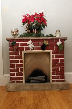 a brick fireplace decorated for christmas with poinsettis