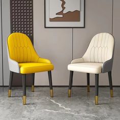 two chairs sitting next to each other in a room