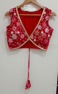 This Made to Order/Made to Measurement/Custom Made Indian Ethnic Blouse. - Fabric - Embroidered Georgette - Color  Red color - Princess Cut - Rich Lined - Shoulder string with latkans - Sleeveless - Extra margin and extra stitches included in the blouse - It can be customize in any color, design or size  MEAUREMENTS & CUSTOMIZATIONS This blouse can be purchased in your standard sizing and pattern. Please choose your Chest Size (measured in inches) from the drop-down box.. For custom sizing pleas Red Bohemian Blouse For Puja, Festive V-neck Choli With Mirror Work, Embroidered Fitted V-neck Choli, Traditional V-neck Choli With Resham Embroidery, Traditional V-neck Choli For Summer, V-neck Choli With Pallu For Puja, Traditional V-neck Embroidered Top For Wedding, Traditional Embroidered V-neck Top For Wedding, Embroidered V-neck Traditional Wear For Festivals