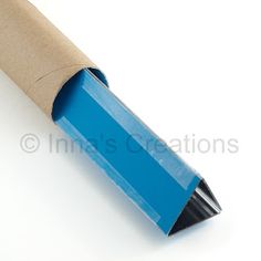 a blue pencil is wrapped in brown paper