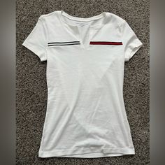 Nwot Tommy Hilfiger T-Shirt With V-Neck Cut White With Brand Colored Stripes Tommy Hilfiger V-neck Tops, Tommy Hilfiger Casual V-neck Top, Casual Tommy Hilfiger V-neck Top, Tommy Hilfiger White Short Sleeve Top, White Short Sleeve Tommy Hilfiger Top, Tommy Hilfiger T Shirt, Tommy Hilfiger Tops, Color Stripes, Brand Colors