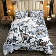 an image of a bed with dinosaurs on it