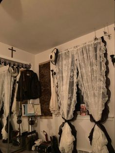 a room that has some clothes hanging on the wall and other items in front of it