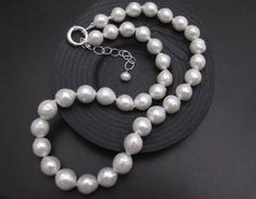 Material : Genuine Natural Freshwater Pearls Quantity : One Necklace Length : 17.5 inch with extender adjustable to 20 inch (including the silver toggle) Color : White Baroque Pearls as pictured Bead Shape : Irregular Baroque Pearls as pictured Bead Size 10-12 mm approx. Clasp Size : 14mm Spring Clasp Lead Time & Shipping : We will ship your order in 1-3 business day once order received. If we offer FREE DOMESTIC shipping, package will be shipped via USPS First Class mail on orders shipping White Pearl Necklace With Sterling Silver Clasp For Anniversary, White Wedding Necklace With Sterling Silver Clasp, Classic White Round Beads Bridal Necklace, White Pearl Drop Bridal Necklace, White Bridal Necklace With Round Beads For Anniversary, Classic White Bridal Necklace With Round Beads, Classic White Bridal Necklace For Anniversary, Classic White Bridal Necklace With Pearl Drop, Formal White Single Strand Bridal Necklace