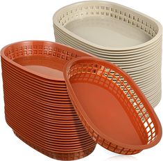 a stack of orange and white plates next to each other