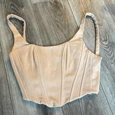 Tan Vici Bustier Size Small Never Worn Fitted Sleeveless Beige Crop Top, Beige Fitted Sleeveless Crop Top, Fitted Cropped Beige Tank Top, Beige Fitted Sleeveless Corset, Beige Fitted Chic Corset, Chic Fitted Beige Corset, Fitted Sleeveless Beige Corset, Sleeveless Beige Corset For Spring, Beige Sleeveless Top With Boned Bodice