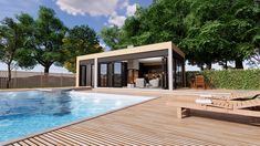 a house with a swimming pool and lounge chairs next to the decking area, surrounded by trees