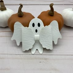 some fake pumpkins with white wings on them