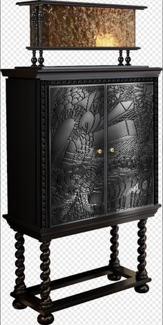 a black cabinet with an ornate design on it's front and side panels, as well as a lamp