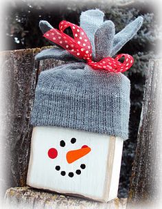 a wooden block with a snowman on it