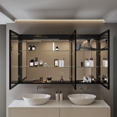 there are two sinks in the bathroom with glass shelves