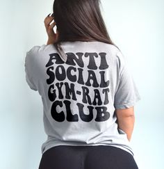 Anti social gym rat club shirt. Funny workout shirt for the gym! *Color shown is granite. Model is a US size 6 wearing a size large for a baggy fit.* UNISEX SHIRT - 100% USA cotton - Pre-shrunk so no need to worry about shrinkage - Comfort Colors Brand - Heavyweight material for a more comfortable fit - Relaxed fit. Order a size up for a more baggy feel. Unisex T Shirt Design, Gym Rat Shirt, Hip Hop Style Gym Tops With Letter Print, Hip Hop Graphic Print Gym Tops, Sporty Graphic Print Shirt For Gym, Sports Graphic Print Gray Shirt, Gray Relaxed Fit T-shirt For Gym, Gray Relaxed Fit Top For Gym, Gym Merchandise Ideas