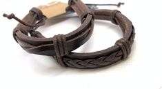 This set of two handcrafted  leather bracelets makes a great couple's gift. Brown Leather Wrap Bracelet For Gift, Brown Leather Braided Bracelet As Gift, Brown Leather Wrap Bracelet As Gift, Brown Leather Wrap Bracelet Gift, Brown Leather Strap Braided Bracelet Gift, Rustic Adjustable Leather Strap Bracelets, Brown Leather Strap Wrap Bracelet Gift, Adjustable Brown Bracelet With Waxed Finish, Handmade Brown Wristband For Friendship