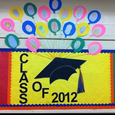 a class of 2012 graduation sign with balloons and a cap on it's head