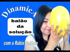 a woman holding a yellow ball in front of her face with the words dynamica on it