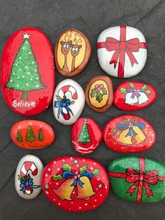 painted rocks with cartoon characters and presents on them