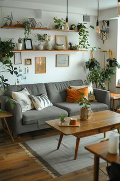 a living room filled with furniture and lots of plants