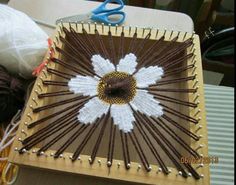 a close up of a table with yarn and scissors