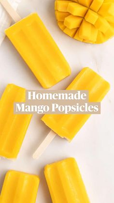 yellow popsicles are sitting on a white table