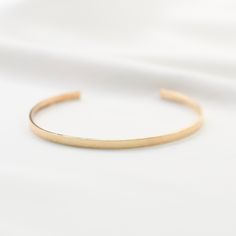 "14K gold cuff bracelet. 14K Gold Minimalist Cuff Bracelet * 14K solid gold. It is about 3mm x 1mm Please select the size of your wrist. If your wrist is 6\", please purchase 6\" bracelet. (If you order a 6\" bracelet, actual cuff length will be 5\" plus 1 inch opening.) Please read our policies before you place your order. https://www.etsy.com/shop/SashJewelry/policy?ref=shopinfo_policies_leftnav To see other Mother daughter necklace set click here: https://www.etsy.com/shop/SashJewelry?section Modern 14k Gold Cuff Bracelet For Everyday, Minimalist Yellow Gold Cuff Bracelet For Formal Occasions, Adjustable Minimalist Gold Bracelet With Polished Finish, Minimalist Polished Cuff Bracelet For Wedding, 14k Gold Polished Minimalist Cuff Bracelet, Minimalist 14k Gold Cuff Bracelet With Polished Finish, Minimalist Wedding Cuff Bracelet With Polished Finish, Minimalist 14k Gold Cuff Bracelet Gift, Minimalist Yellow Gold Cuff Bracelet For Wedding