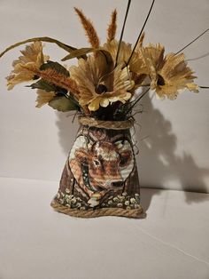 a vase filled with flowers on top of a table