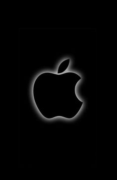 an apple logo is shown in the dark