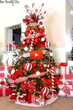 a christmas tree decorated with candy canes and bows