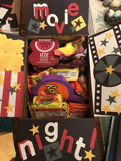 an open box filled with candy and snacks